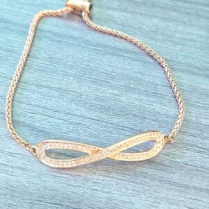 Infinity rose goldtone bracelet w clear rhinestone crystals NWOT New w Out Tags